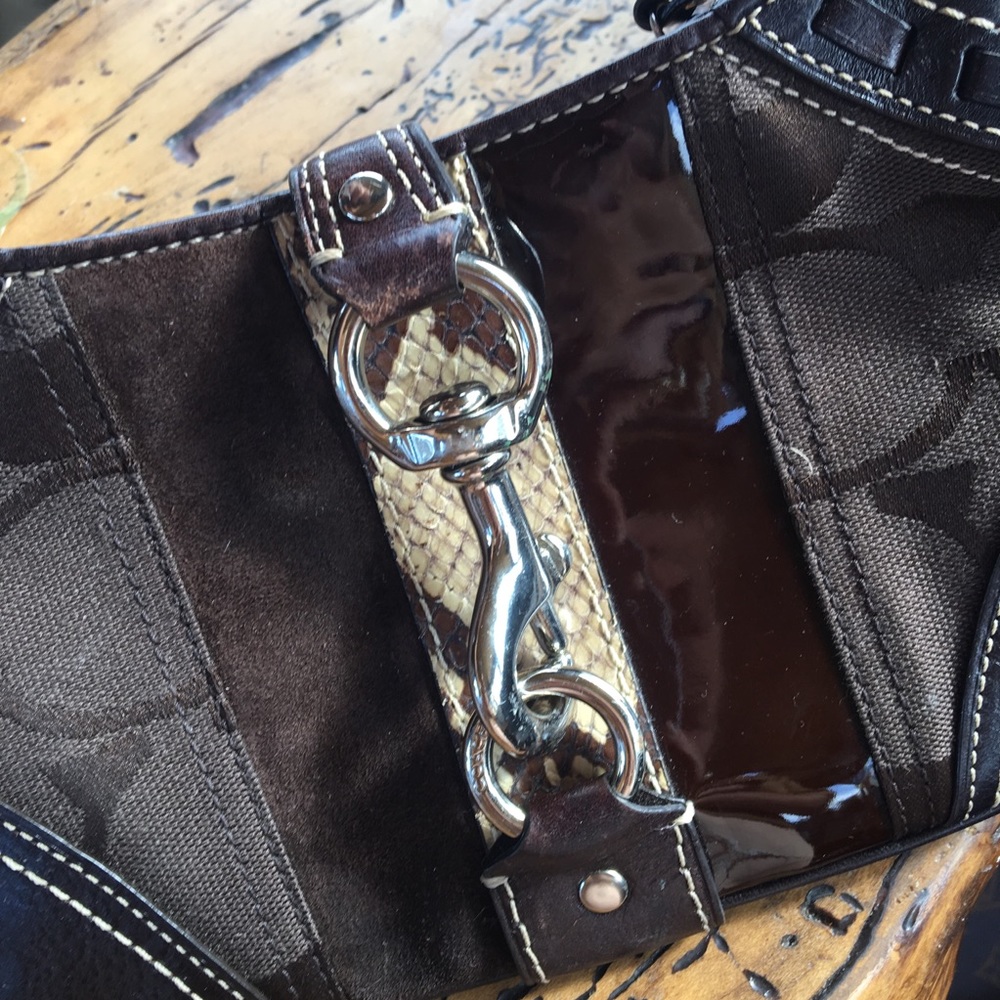 Coach handbag, monogram and snake skin details.